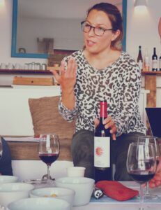 Woman talking about Wine at a Wine Tasting