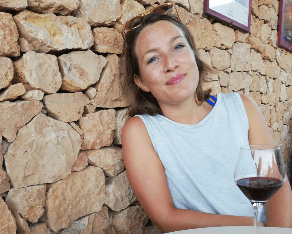 Portrait of a woman with a glass of wine on a wine tasting